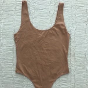 tan/nude thong body suit